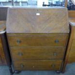 An inlaid walnut gramophone cabinet and an oak bureau