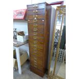 An oak eighteen drawer filing cabinet