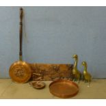 A pair of brass figures of ducks and three pieces of copperware