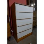 A teak and white laminate chest of drawers