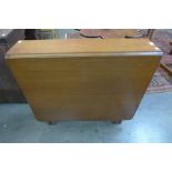 A teak drop leaf table