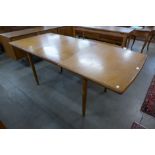 A teak extending dining table