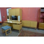 A G-Plan Quadrille teak four piece bedroom suite, comprising; three door wardrobe, chest of drawers,