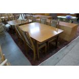 A Nathan teak extending dining table and four chairs