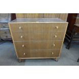 A Heals afromosia two piece bedroom suite, comprising; two door wardrobe and chest of drawers