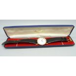 A 9ct gold Tissot wristwatch, the case back bears inscription dated 1980, 31mm case