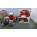 An Ertl Farmall 350 tractor and F-20 tractor, boxed and two other Ertl tractors, play worn