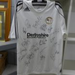 A signed Derby County football shirt, 2007 promotion squad including Robbie Savage etc., plus