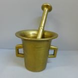 A bronze pestle and mortar