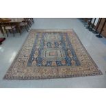 An eastern salmon pink and blue ground hand knotted rug, 337 x 275cms