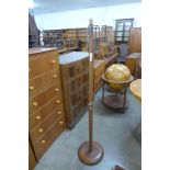 A teak floor standing lamp