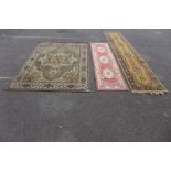 Three assorted rugs