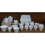 Tuscan china tea and coffee cups and saucers, a coffee pot and two cream jugs and two sugar bowls