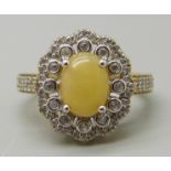 A silver gilt, Ethiopian opal and white zircon cluster ring, P