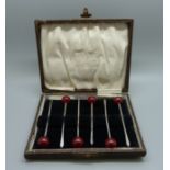A boxed set of six silver olive picks, Birmingham 1927