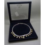 A white and yellow stone necklace in original box by Attwood