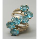 A silver and topaz ring, L