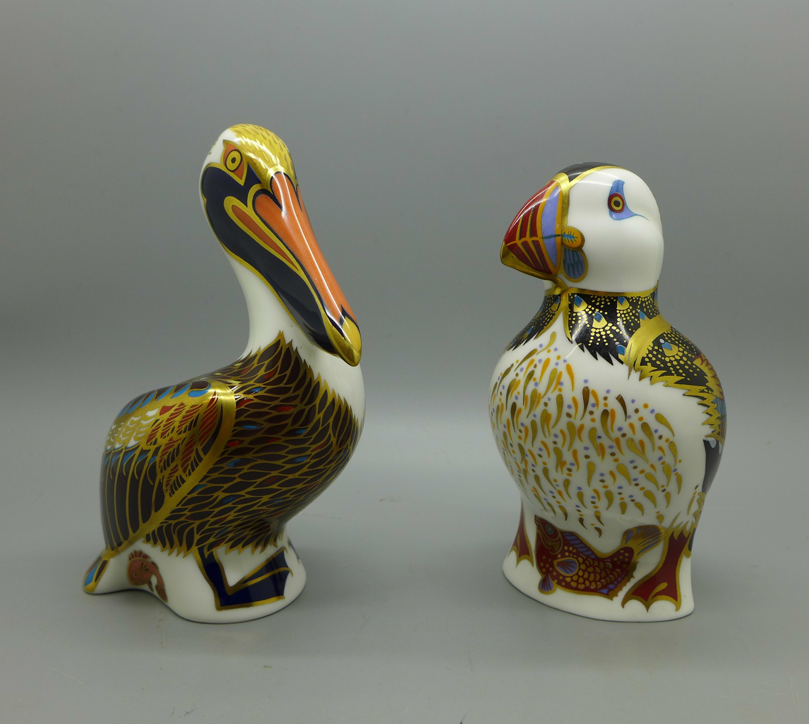 Two Royal Crown Derby Sea Bird paperweights, Puffin and Brown Pelican, both 13cm high, silver