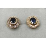 A pair of sapphire and diamond cluster ear studs, one marked 750, the butterflies marked 750, 3.5g