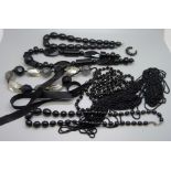 A collection of black bead jewellery