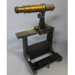 A surveying tool/scope on stand, height 25cm