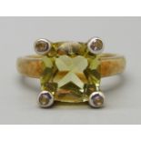 A 9ct gold ring set with a yellow stone and four white stones, 4.8g, N