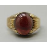 A 9ct gold and cabochon garnet ring, maker Y & B, stone size 11.94mm x 10.03mm x 4mm, weight 5.4g, Q