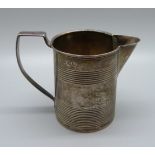 A George III silver jug, London 1811, with initials, 82g