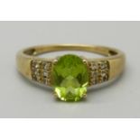 A 9ct gold, peridot and diamond ring, 2.4g, O