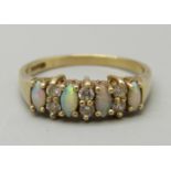 A 9ct gold, opal and CZ ring, 1.9g, N