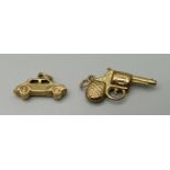 A 9ct gold revolver charm and a 9ct gold car charm, 1.7g