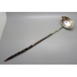 A Georgian silver ladle with baleen handle, worn London hallmark