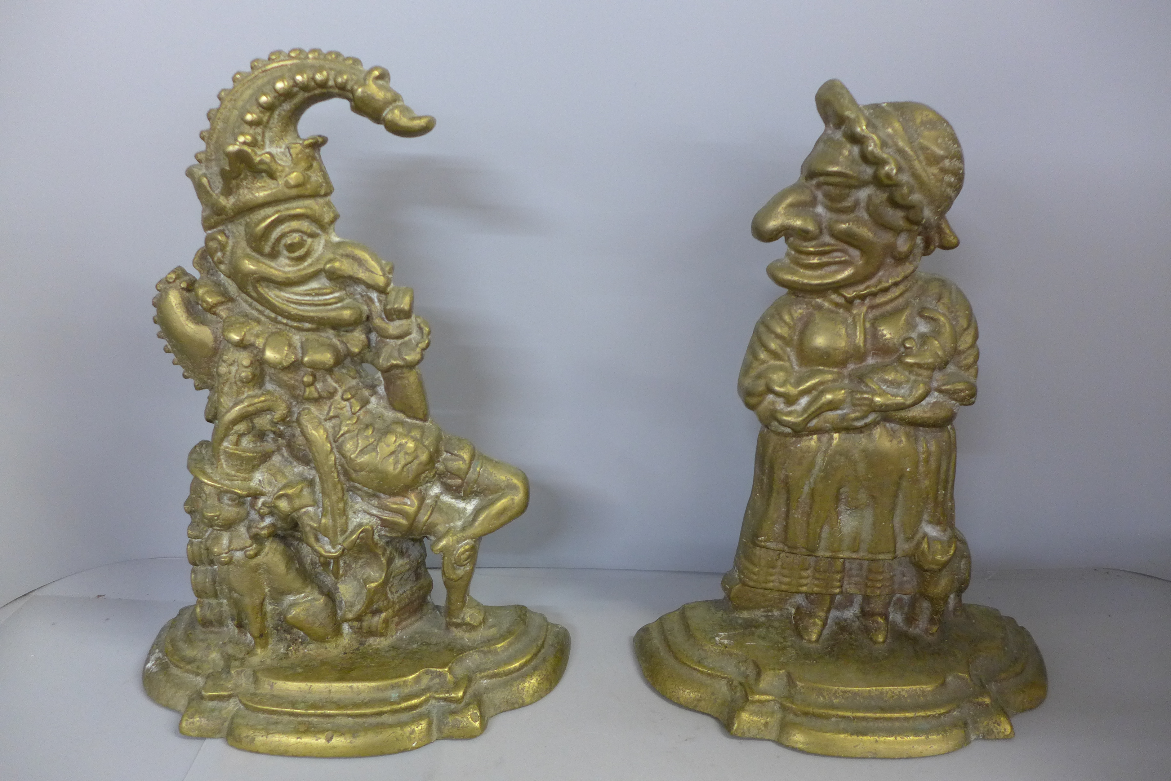 A pair of heavy brass Punch and Judy doorstops