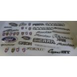 A collection of assorted Ford car badges
