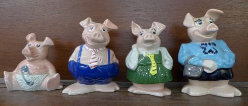 Four Nat West pig money banks; Mum, Brother, Sister and Baby