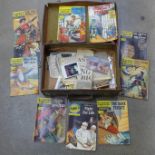 A case of comics including Worlds Finest, Classics Illustrated, etc.