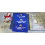 A collection of foreign banknotes, commemorative coins, silver half dollar and medals and a