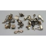 A collection of silver charms