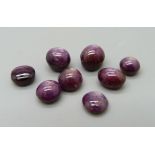 Eight unmounted cabochon rubies
