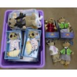 A collection of fourteen Meerkat toys including three babies, Aleksander, Maiya, Vassily and