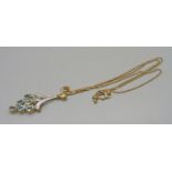 A 9ct gold, diamond and aquamarine pendant, on a fine 9ct gold chain, 5.3g