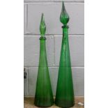 Two tall green glass vases