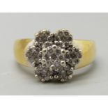 A yellow metal and diamond multi-cluster ring, marked 18K, 8.9g, R