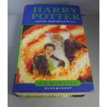 One volume, Harry Potter and the Half-Blood Prince, first edition, stamped Boston High School