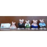 A set of five Nat West pig money banks, with cheque book