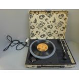 A vintage record player with applied Beatles cover