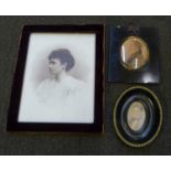 A Georgian watercolour miniature, one other later miniature and a framed photograph on white glass