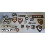 A collection of car badges including Lancia, BMW 1800, etc., and a LDV badge