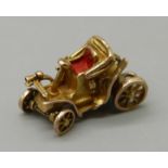 A 9ct gold vintage car charm, with moveable wheels, 2.5g