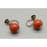 A pair of vintage 9ct gold and coral screw back earrings